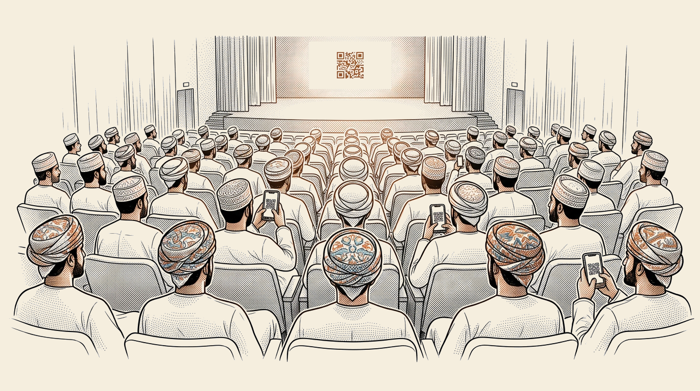 القاعَةُ تَمتَلِئُ — هَواتِفُ تُمسَكُ، أَنفاسٌ تَنتَظِر